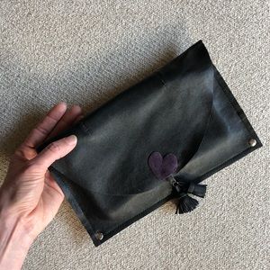 Kennakristine leather clutch with tassels